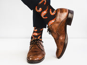 Black cotton Shrimp Socks with orange patterns for men and women, multiple angled views on white background